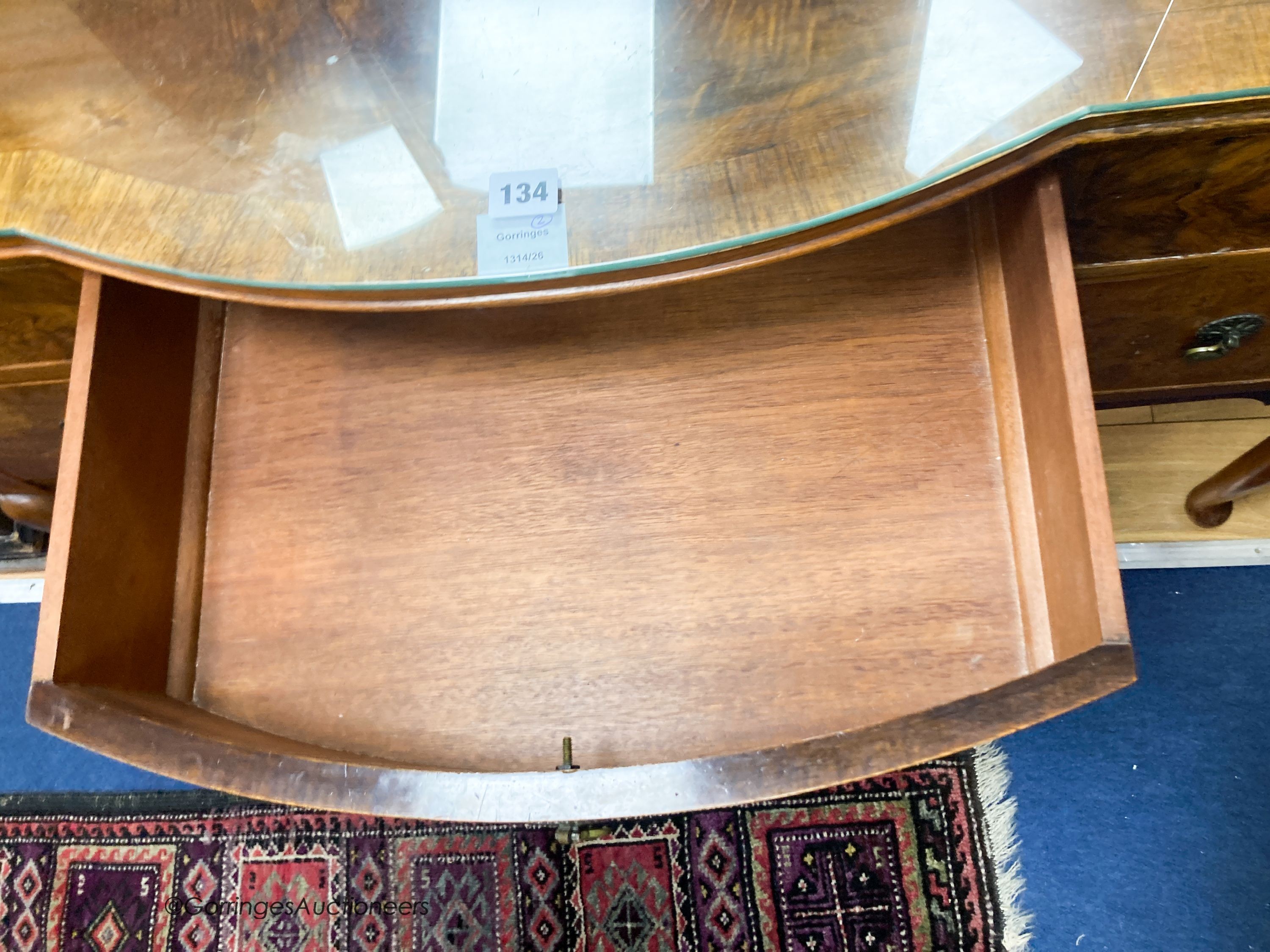 A 1930’s burr walnut dressing table, width 114cm, depth 52cm, height 160cm and a cane topped stool (2)